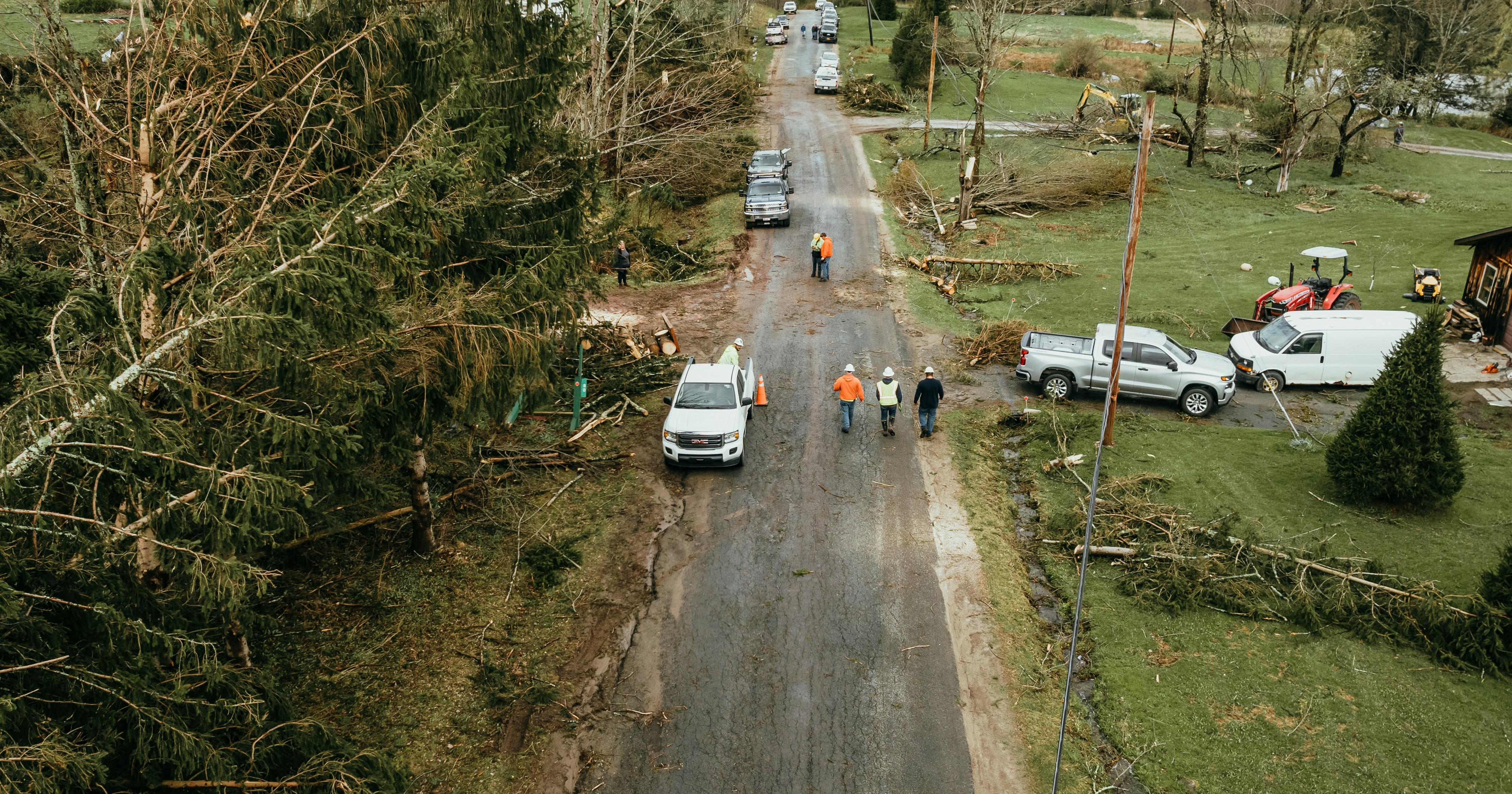 Storm-damaged tree limbs and debris in a residential setting